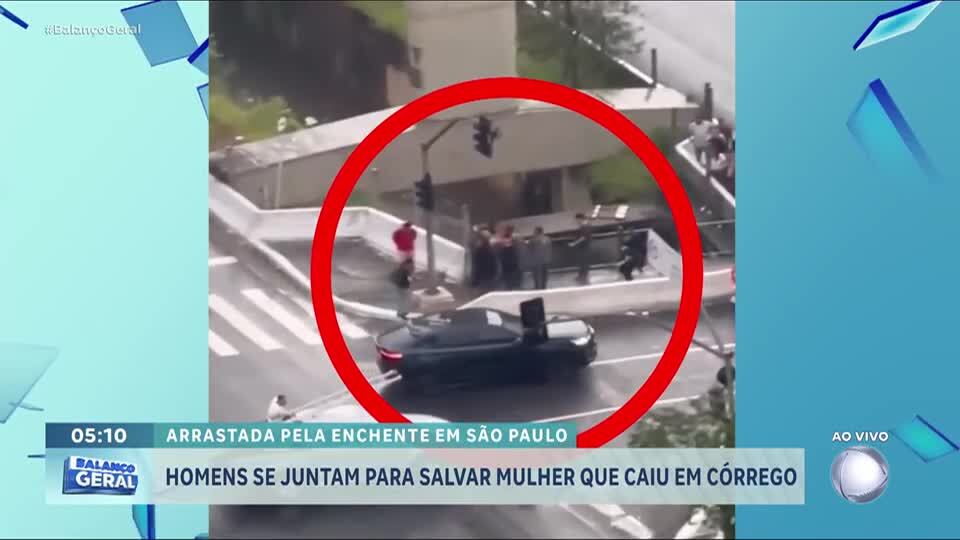 Homens se juntam para salvar mulher que caiu em córrego durante chuva em São Paulo