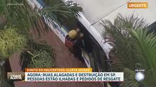 Bombeiros trabalham para resgatar vítimas de ônibus ilhado durante chuva em SP
