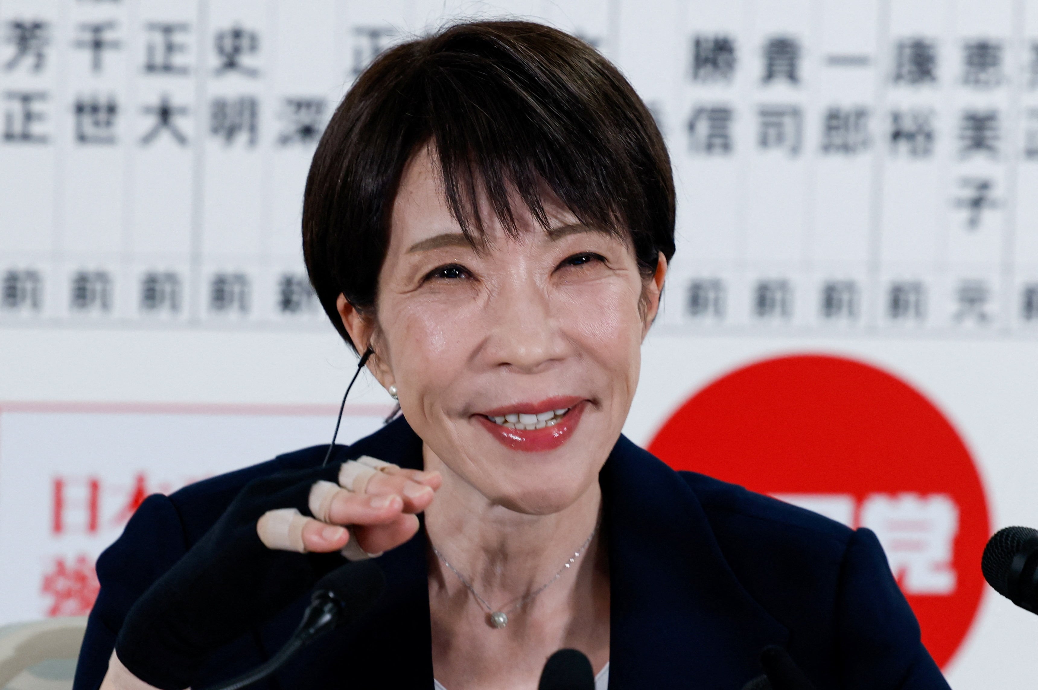 Japan's Prime Minister Sanae Takaichi, leader of the ruling Liberal Democratic Party (LDP), who has previously suffered a hand injury, speaks to the media at the LDP headquarters on general election day in Tokyo, Japan, February 8, 2026.