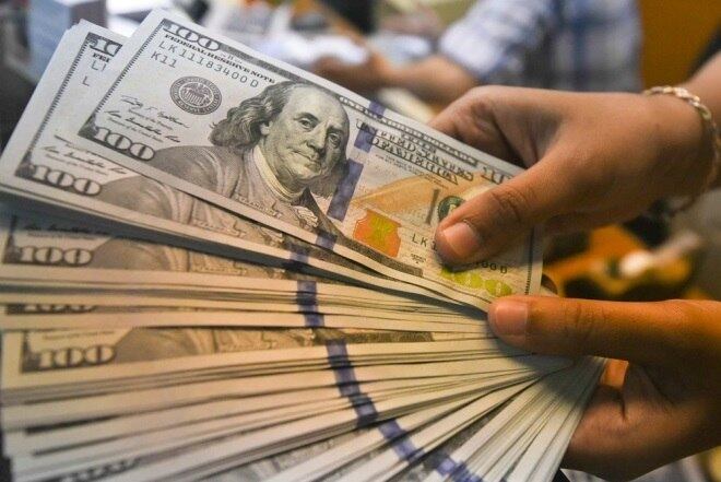 Dólar caía 0,6% a R$ 4,0540