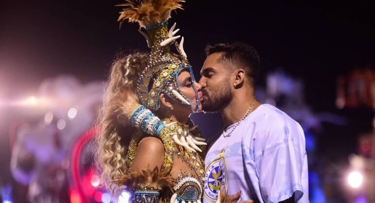 A musa Erika Schneider e o marido, Bil Araújo