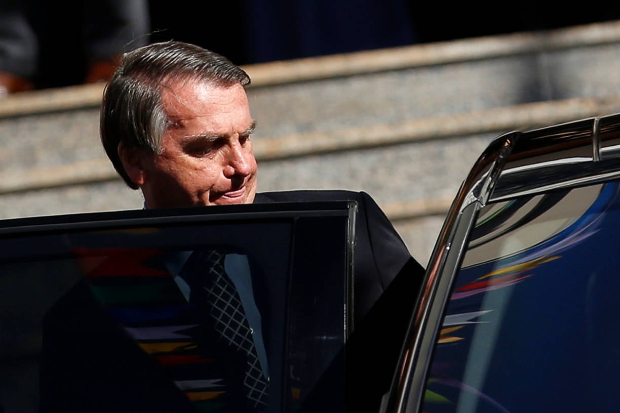 Brazil's President Jair Bolsonaro walks after attending Mass at a Catholic church in Brasilia, Brazil July 1, 2021. REUTERS/Adriano Machado