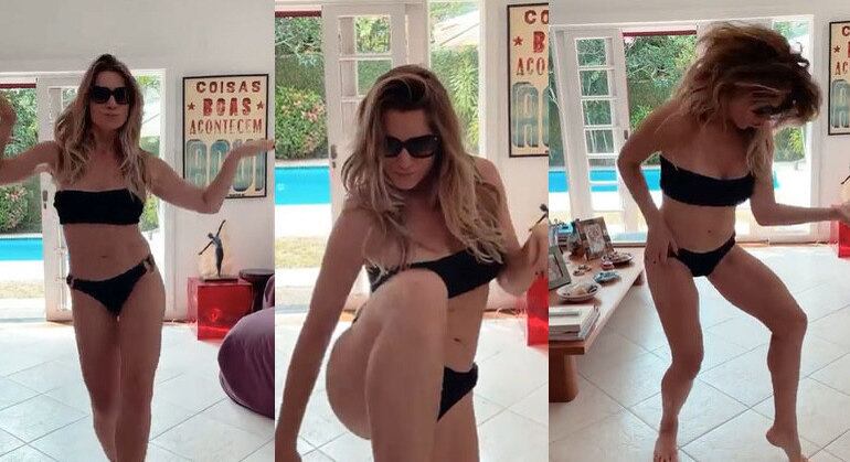 De biquíni na sala de casa, Letícia Spiller apareceu dançando a canção Una Esperanza