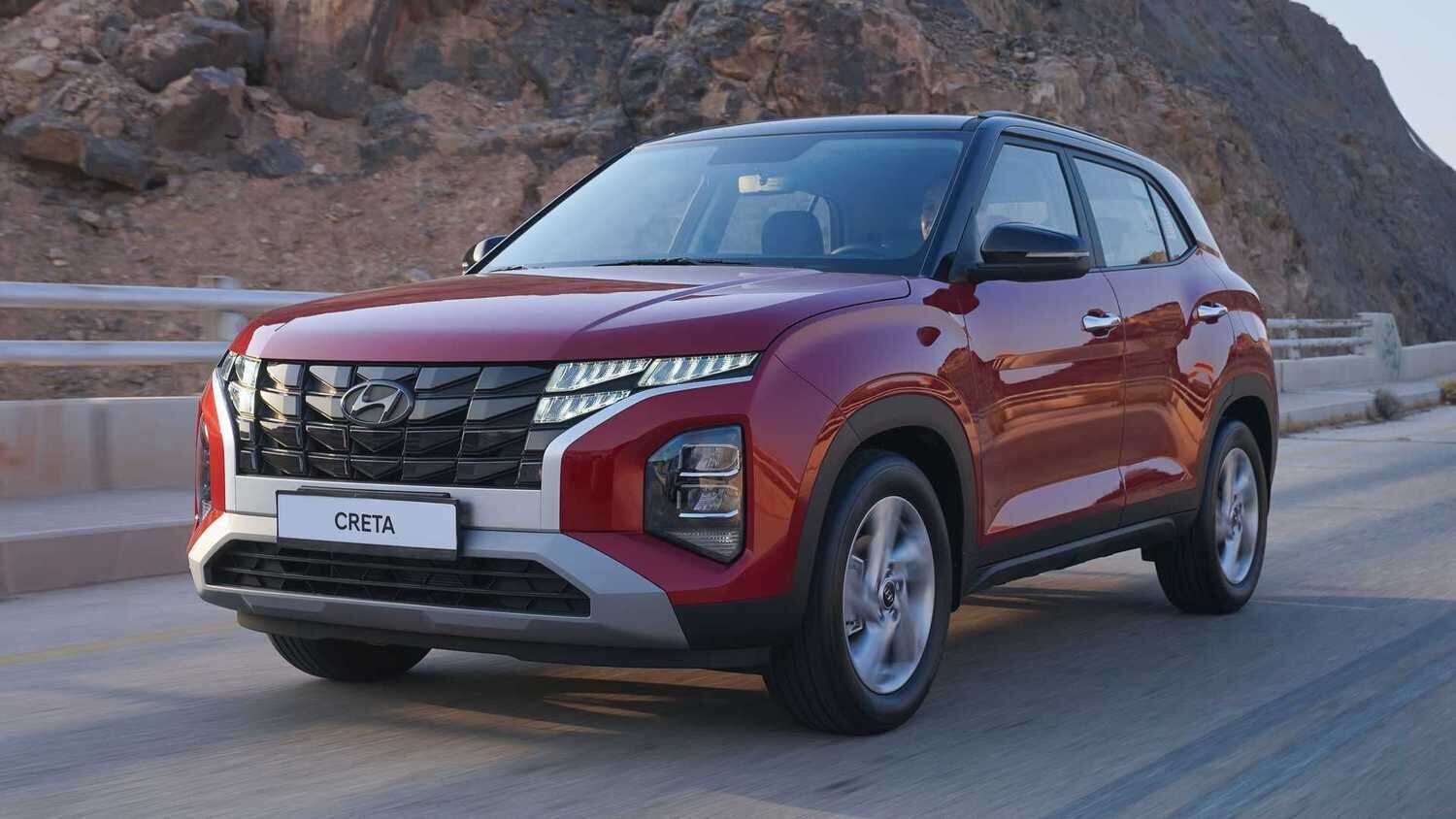 Grade parametrizada com ampla moldura cinza e farois do tipo projetor nas extremidades: herança do Tucson