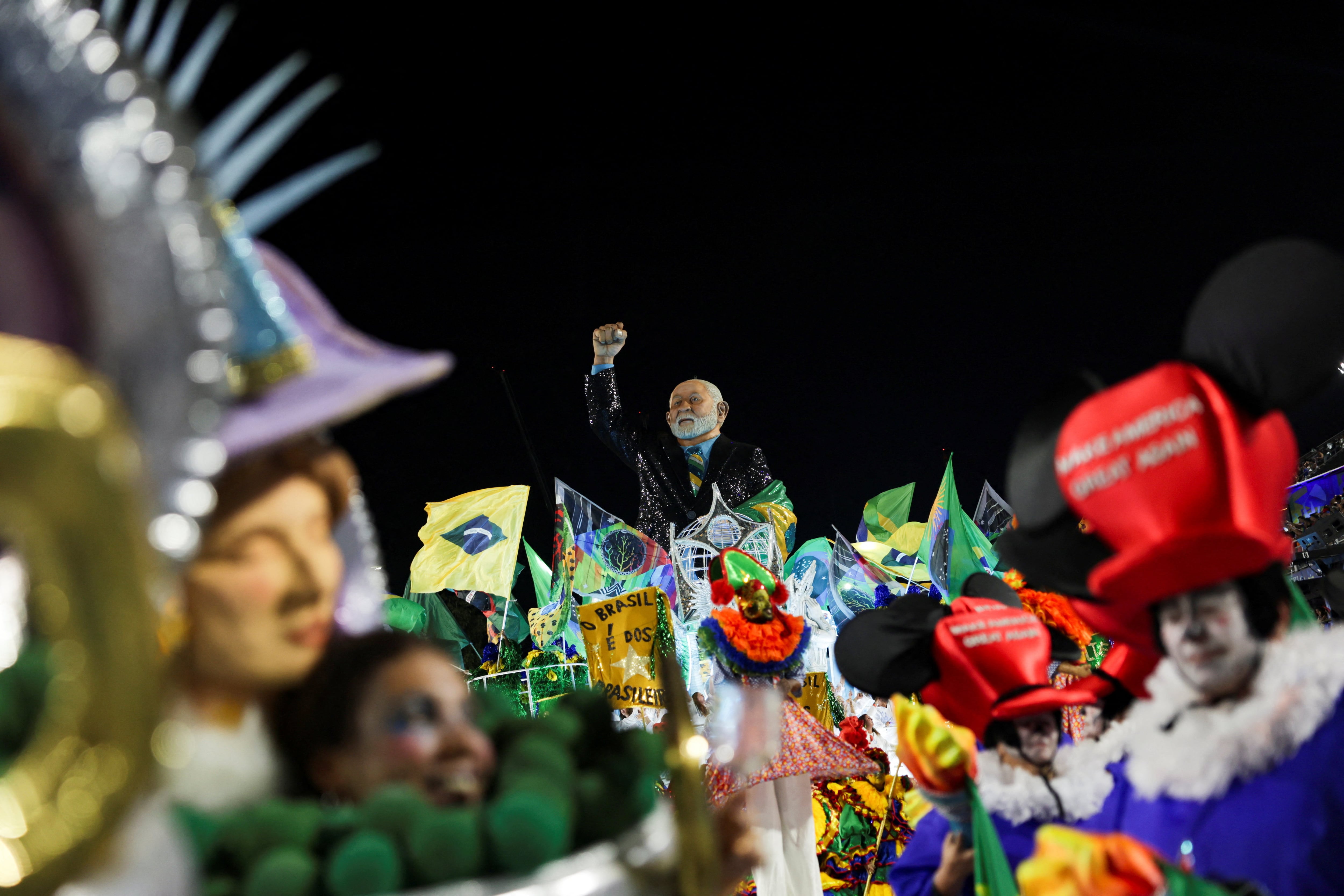 A carnival float depicting Brazil's President Luiz Inacio Lula da Silva is displayed as revellers from the Academicos de Niteroi samba school perform during the Carnival in Rio de Janeiro, Brazil, February 15, 2026. REUTERS/Ricardo Moraes