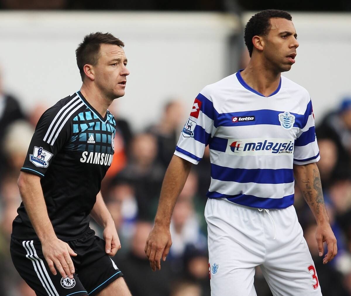 Há três anos atrás, John Terry foi acusado por Anton Ferdinand, do Queens Park Rangers na época, de tê-lo chamado de "preto", sendo considerado um caso de racismo e que chegou a ir para julgamento. O fato nunca foi perdoado pelo irmão de Anton, Rio Ferdinand, pois Terry jamais pediu desculpas