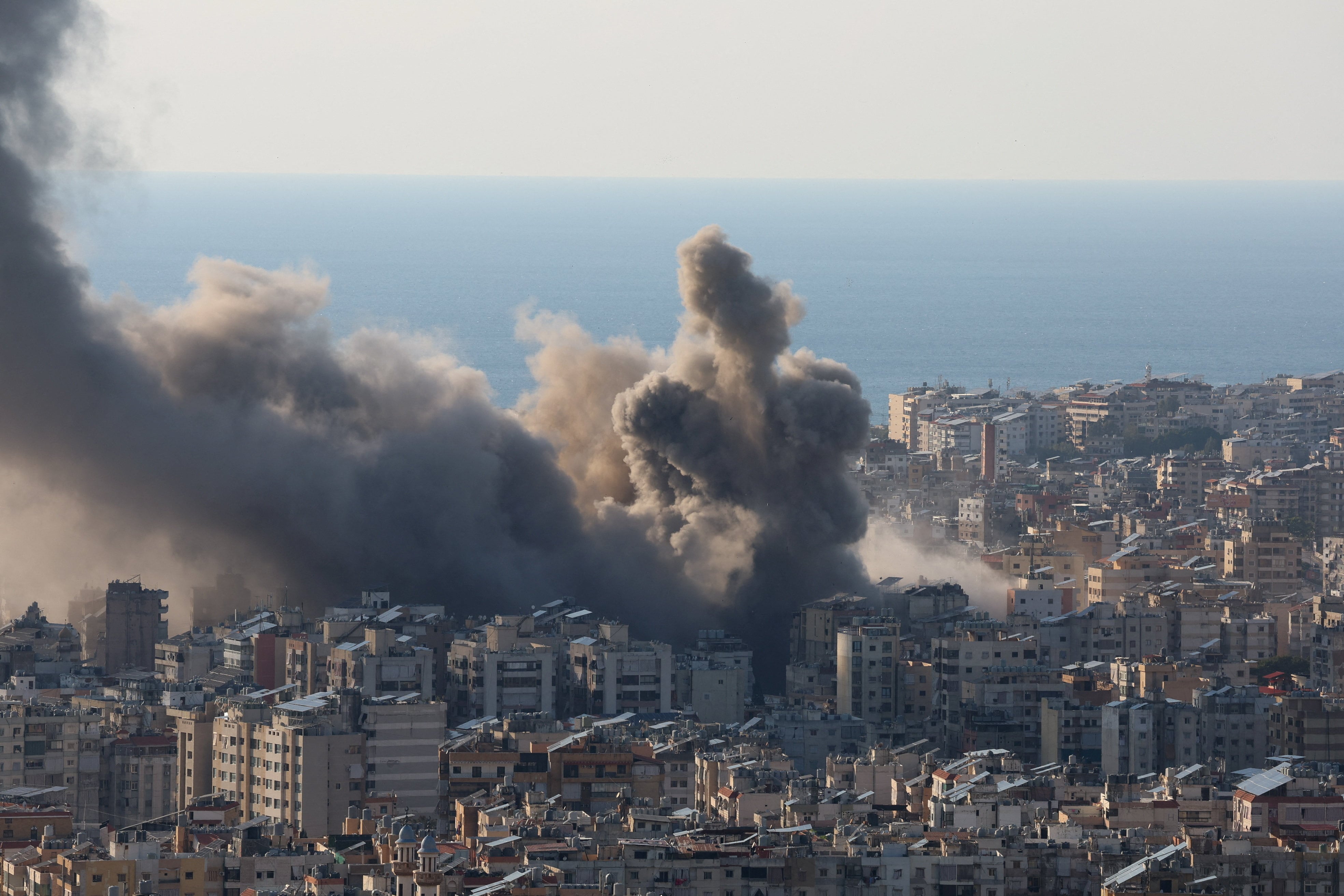 Smoke and dust rise after an Israeli strike on Beirut's southern suburbs, following an escalation between Hezbollah and Israel amid the U.S.-Israeli conflict with Iran, Lebanon, March 2, 2026. REUTERS/Mohamed Azakir
