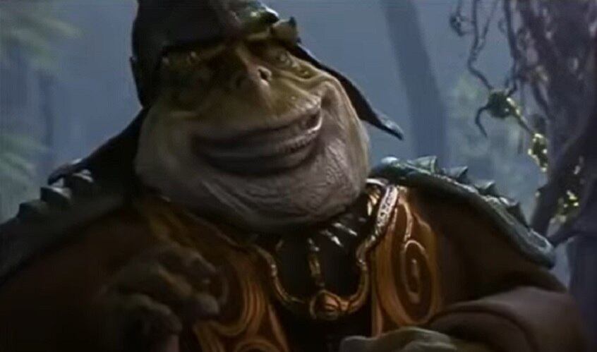 Nome do personagem: Boss Nass - Filme: A Ameaça Fantasma (1999) - Líder dos Gungans, defende muito os valores do seu povo e era contrário à boa convivência com o povo humano de Naboo. Foi convencido pela rainha Amidala a ajudar na luta contra a Federação de Comércio.