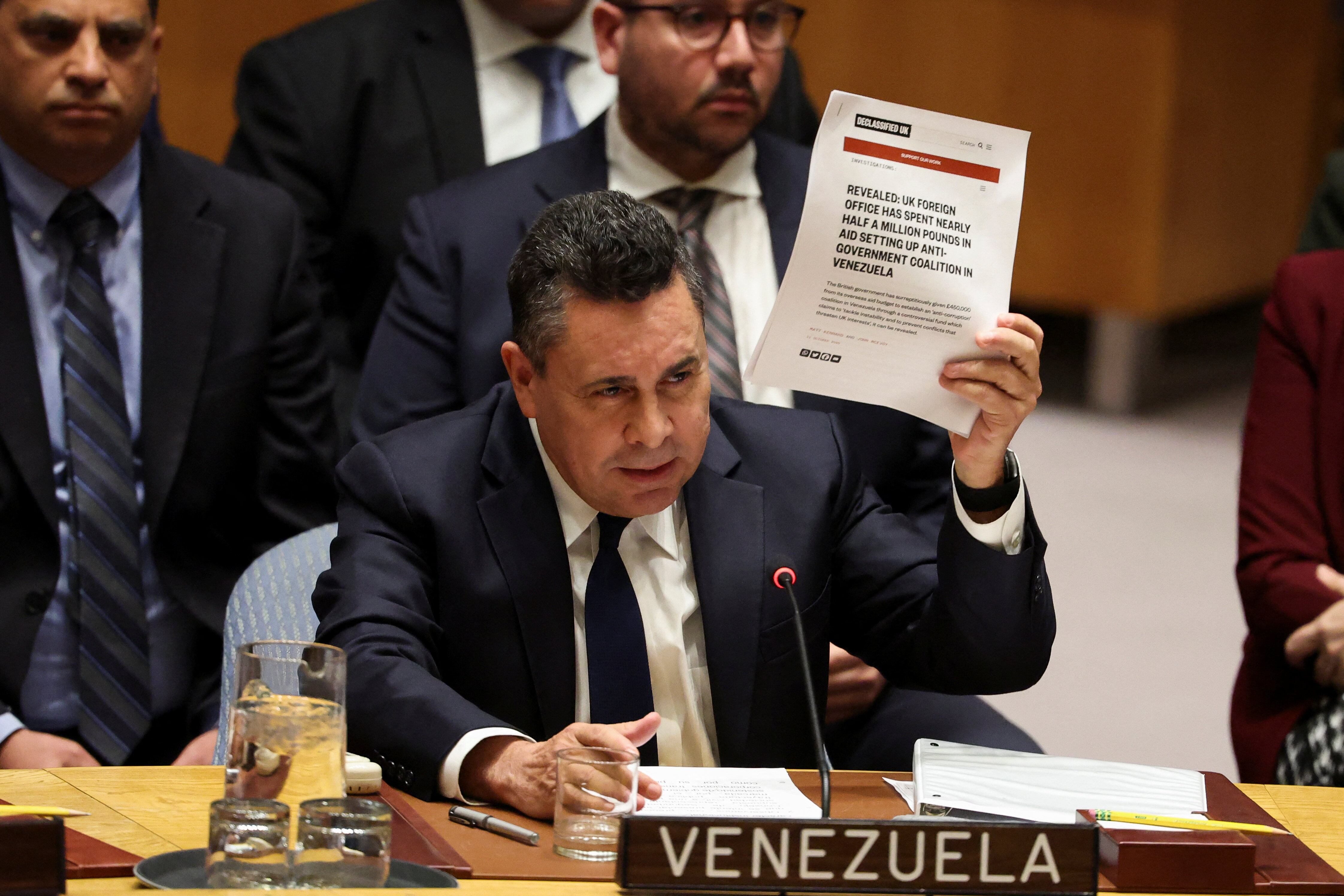 Venezuela Ambassador to the United Nations Samuel Reinaldo Moncada Acosta speaks as he holds up a news article, during a UN Security Council meeting on U.S. strikes and the capture of Venezuelan President Nicolas Maduro and his wife, Cilia Flores, at the United Nations headquarters in New York, U.S., January 5, 2026. REUTERS/Brendan McDermid