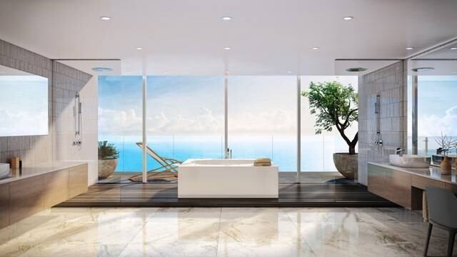 Sala de estar, suíte master? Nada disso, o ambiente arejado da foto acima é apenas o banheiro de um dos apartamentos do imóvel, que contarão com decoração personalizada e mimos como aquecedor de toalha, acessórios de grife e bancada de pedras exóticas 
